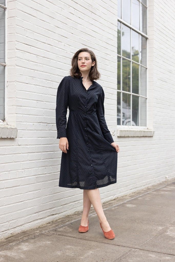 woman modeling black Brom dress