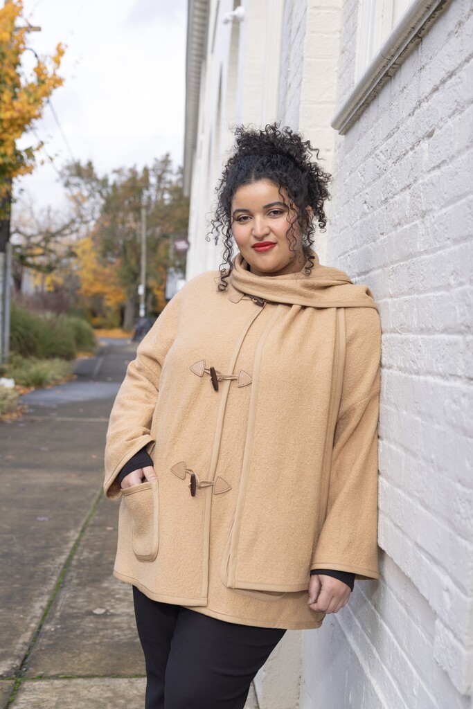 woman modeling the Ivy coat outside