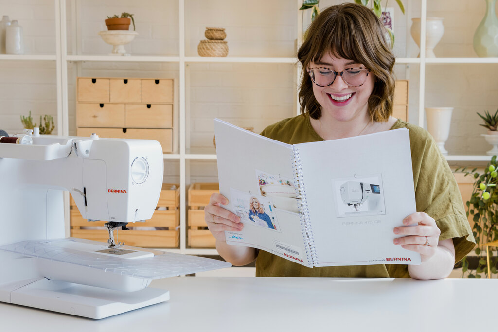 Haley sitting next to a sewing machin3
