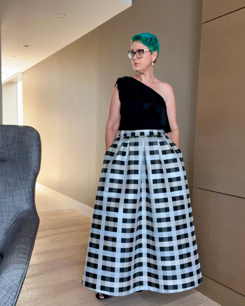 Rebecca in a checkered skirt