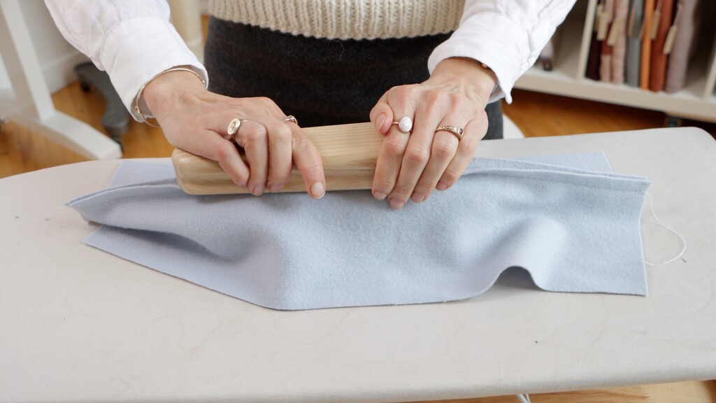 Demonstration of pressing a seam with clapper on seam roll