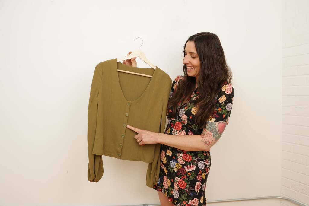 Sarai pointing to finished placket