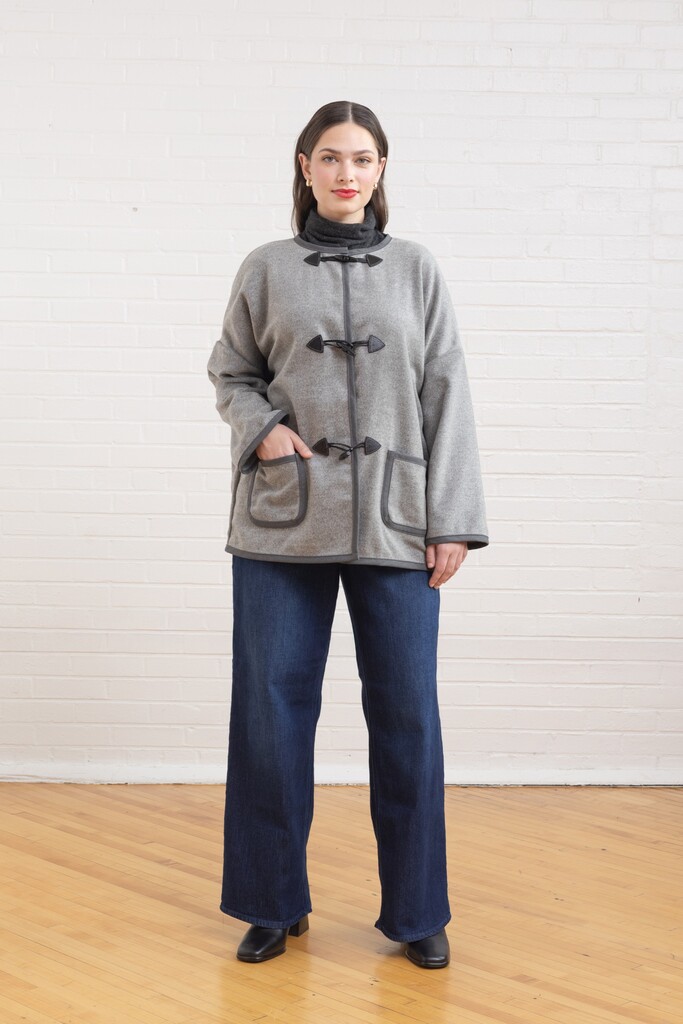 woman modeling Ivy coat with pocket detail