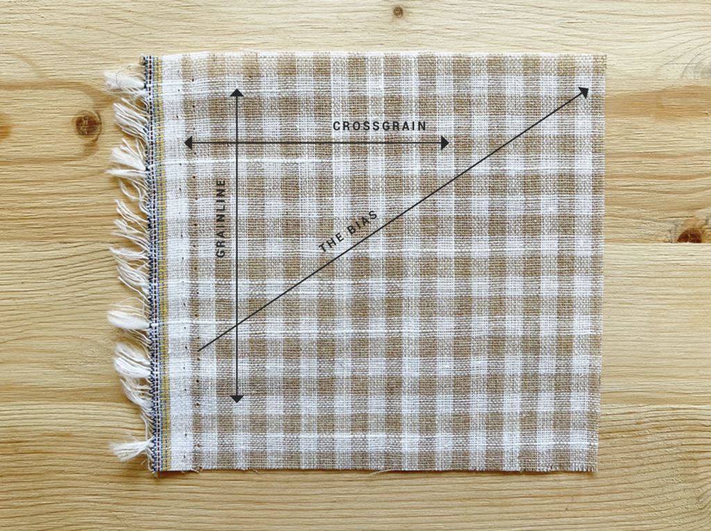 Grainline and cross grain on a fabric scrap